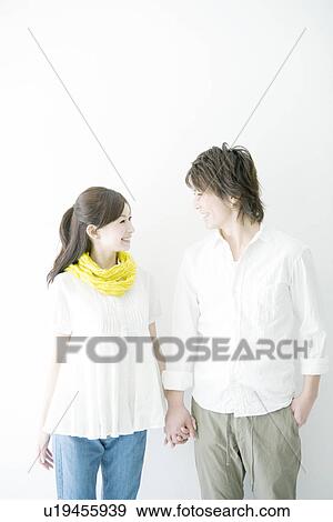 Stock Photo - Couple Holding Hands. Fotosearch