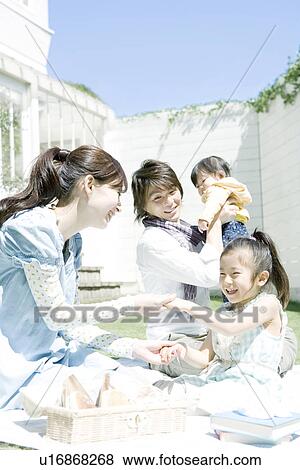Stock Photo - Family in the Yard. Fotosearch