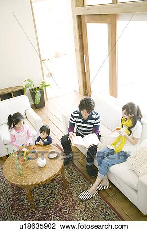 Family of Four in the Living Room View Large Photo Image Stock Image - Family of Four in the Living Room. Fotosearch