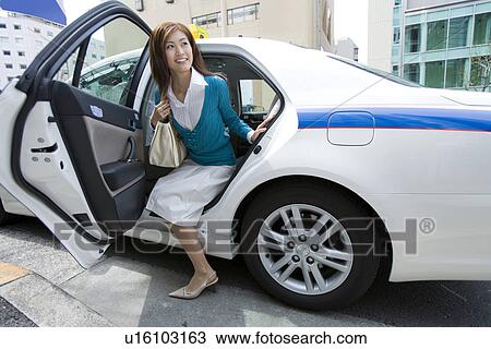 A Woman Getting out of Taxi View Large Photo Image Stock Image - A Woman Getting out of Taxi. Fotosearch