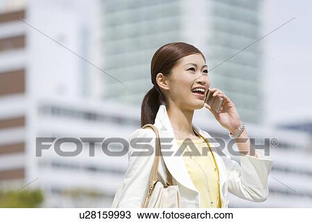 A Woman Talking on the Phone View Large Photo Image Stock Image - A Woman Talking on the Phone. Fotosearch