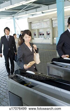 Stock Photo - Commuters at a Station. Fotosearch