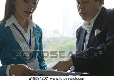 Stock Photo - People Discussing by the Window. Fotosearch