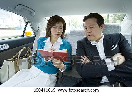Stock Photo - People in a Taxi. Fotosearch