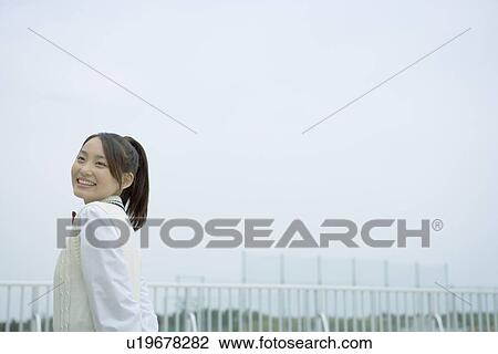 High school student on the roof of school, smiling, copy space View Large Photo Image Stock Image - High school student on the roof of school, smiling, copy space. Fotosearch