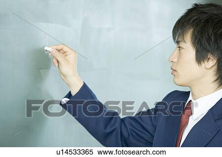 High school student writing on blackboard View Large Photo Image Stock Photography - High school student writing on blackboard. Fotosearch