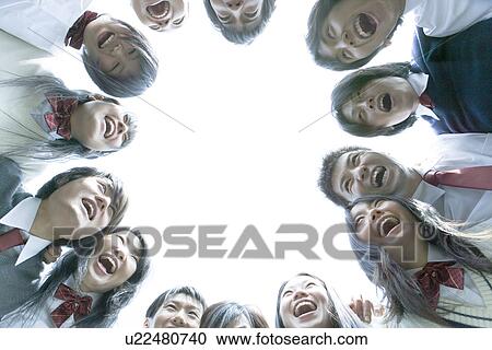 High school students in huddle, smiling, white background View Large Photo Image Stock Image - High school students in huddle, smiling, white background. Fotosearch