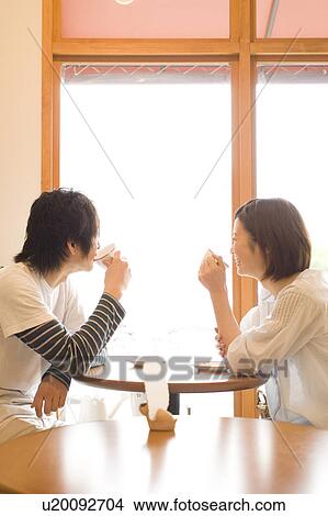 Picture - Couple at a café. Fotosearch