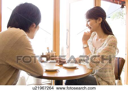 Picture - Couple at a café. Fotosearch