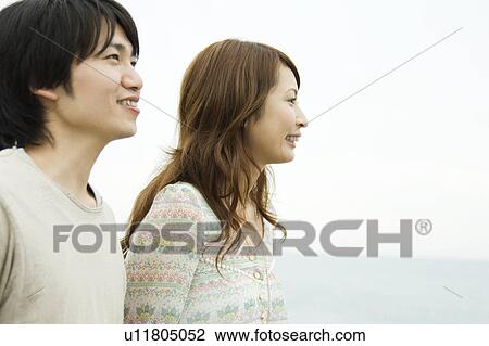 Couple looking away View Large Photo Image Stock Image - Couple looking away. Fotosearch