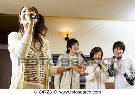 Group of young people at karaoke bar View Large Photo Image Stock Image - Group of young people at karaoke bar. Fotosearch