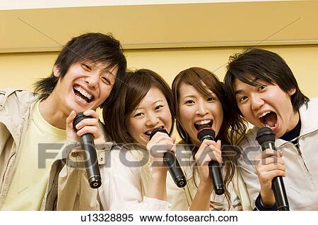 Group of young people at karaoke bar View Large Photo Image Stock Photography - Group of young people at karaoke bar. Fotosearch