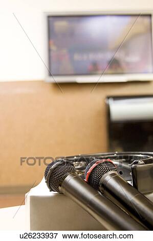 Microphones at karaoke bar View Large Photo Image Stock Photo - Microphones at karaoke bar. Fotosearch