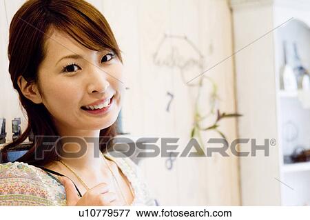 Stock Photo - Portrait of young woman . Fotosearch