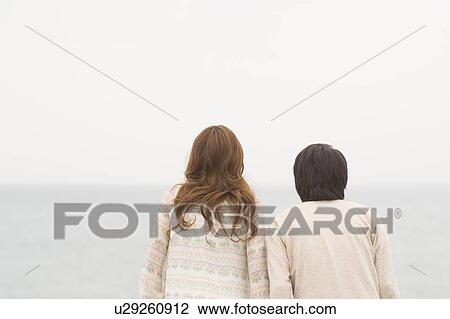 Stock Image - Rear View of couple. Fotosearch