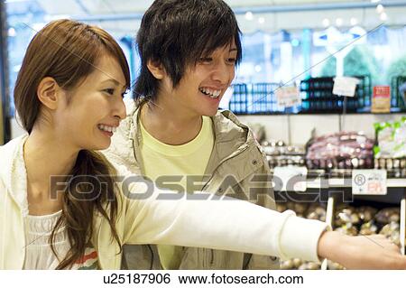 Stock Photograph - Young couple shopping. Fotosearch