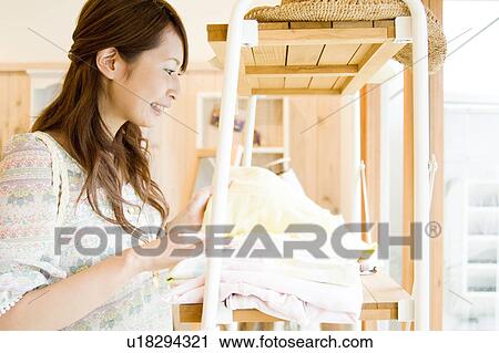 Young woman shopping View Large Photo Image Stock Image - Young woman shopping. Fotosearch