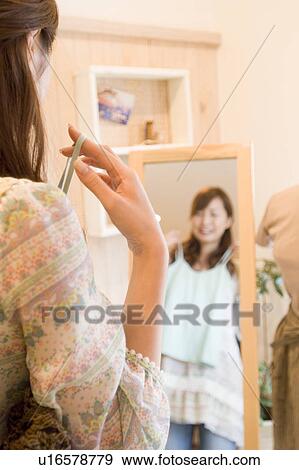 Stock Photo - Young woman shopping. Fotosearch