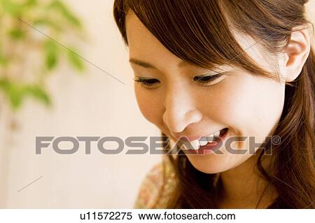 Young woman smiling View Large Photo Image Stock Photography - Young woman smiling. Fotosearch