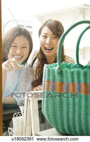Young women window shopping View Large Photo Image Stock Image - Young women window shopping. Fotosearch