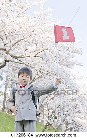 Picture - A Boy Holding No. 1 Flag. Fotosearch