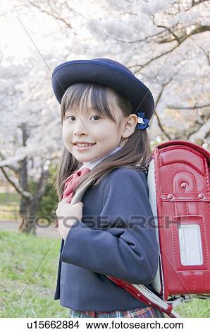 Picture - A Girl Carrying School Bag. Fotosearch