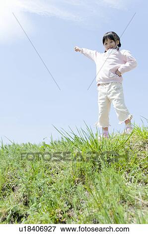 A Girl Pointing the Sky View Large Photo Image Stock Photo - A Girl Pointing the Sky. Fotosearch