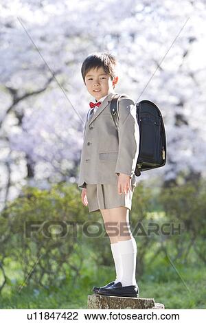 Stock Image - A New Student Carrying School Bag. Fotosearch