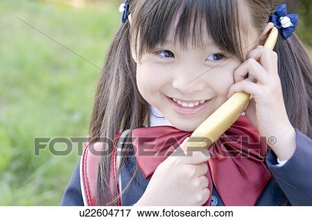 A New Student Talking on the Phone View Large Photo Image Stock Photo - A New Student Talking on the Phone. Fotosearch