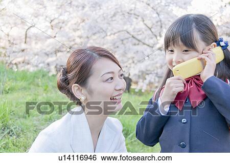 Stock Photograph - A New Student Talking on the Phone. Fotosearch