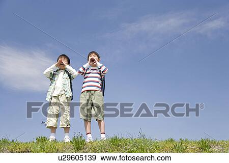 Boys in a bank View Large Photo Image Stock Photo - Boys in a bank. Fotosearch