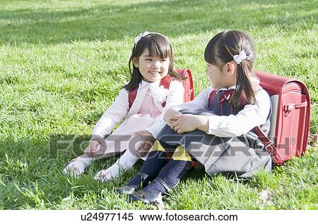 Girls Sitting on Grass and Talking View Large Photo Image Stock Photography - Girls Sitting on Grass and Talking. Fotosearch