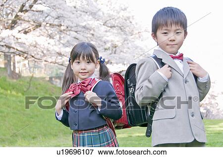 New Student Wearing Uniform and Carrying School Bag View Large Photo Image Stock Photo - New Student Wearing Uniform and Carrying School Bag. Fotosearch