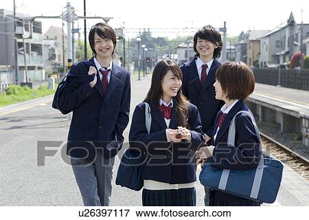 Stock Photo - High school students at platform, smiling. Fotosearch