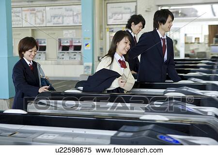 High school students walking through automatic ticket wicket at station View Large Photo Image Stock Photography - High school students walking through automatic ticket wicket at station. Fotosearch