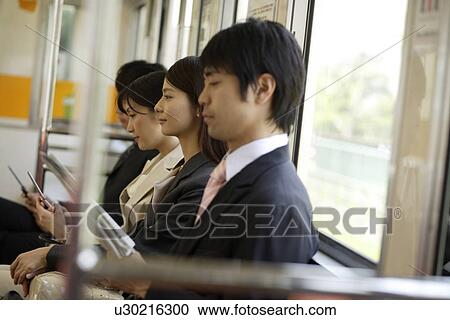 People on the train, sitting on the seat View Large Photo Image Stock Image - People on the train, sitting on the seat. Fotosearch