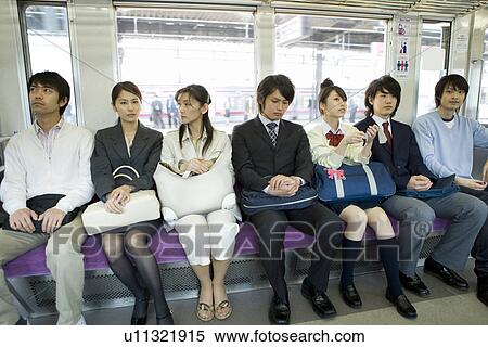 Stock Photography - People on the train, sitting on the seat. Fotosearch