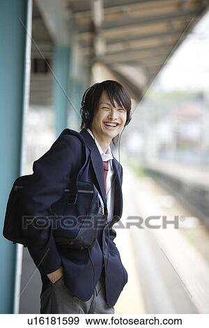 Portrait of a high school student at platform, smiling View Large Photo Image Stock Photo - Portrait of a high school student at platform, smiling. Fotosearch
