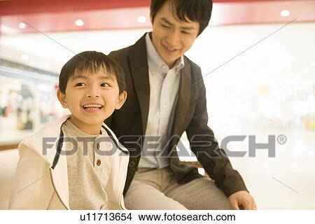 Father and Son Shopping in Department Store View Large Photo Image Picture - Father and Son Shopping in Department Store. Fotosearch