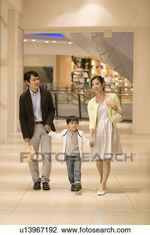 Son and Two Parent Shopping in Department Store View Large Photo Image Stock Image - Son and Two Parent Shopping in Department Store. Fotosearch