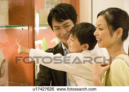 Son and Two Parent Shopping in Department Store View Large Photo Image Stock Photograph - Son and Two Parent Shopping in Department Store. Fotosearch