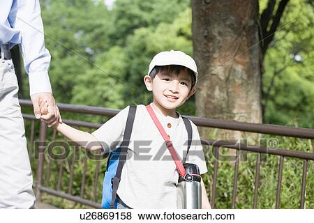 Stock Photo - Son Holding His Fathers Hand. Fotosearch
