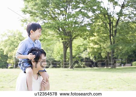Son Piggybacks on Father View Large Photo Image Stock Photo - Son Piggybacks on Father. Fotosearch