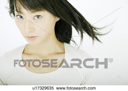 A young woman looking at camera View Large Photo Image Stock Photography - A young woman looking at camera. Fotosearch