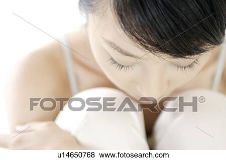 A young woman looking down View Large Photo Image Stock Photo - A young woman looking down. Fotosearch
