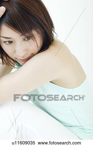 A young woman sitting View Large Photo Image Stock Photography - A young woman sitting. Fotosearch