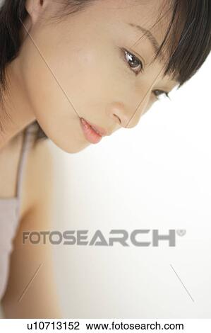 Stock Image - A young woman smiling. Fotosearch