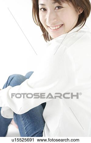 A young woman smiling View Large Photo Image Stock Image - A young woman smiling. Fotosearch