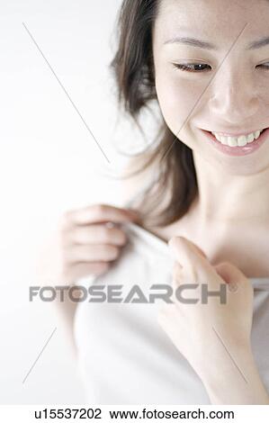 Stock Image - A young woman smiling. Fotosearch
