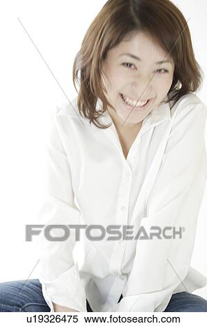 Stock Photography - A young woman smiling. Fotosearch
